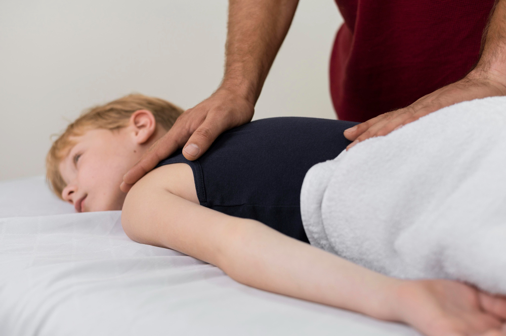 Child receiving gentle chiropractic adjustment in Wall Township NJ.