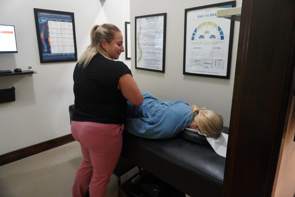 Prenatal Chiropractic Care in Wall Township NJ Pregnant woman receiving gentle prenatal chiropractic adjustment in Wall Township NJ.